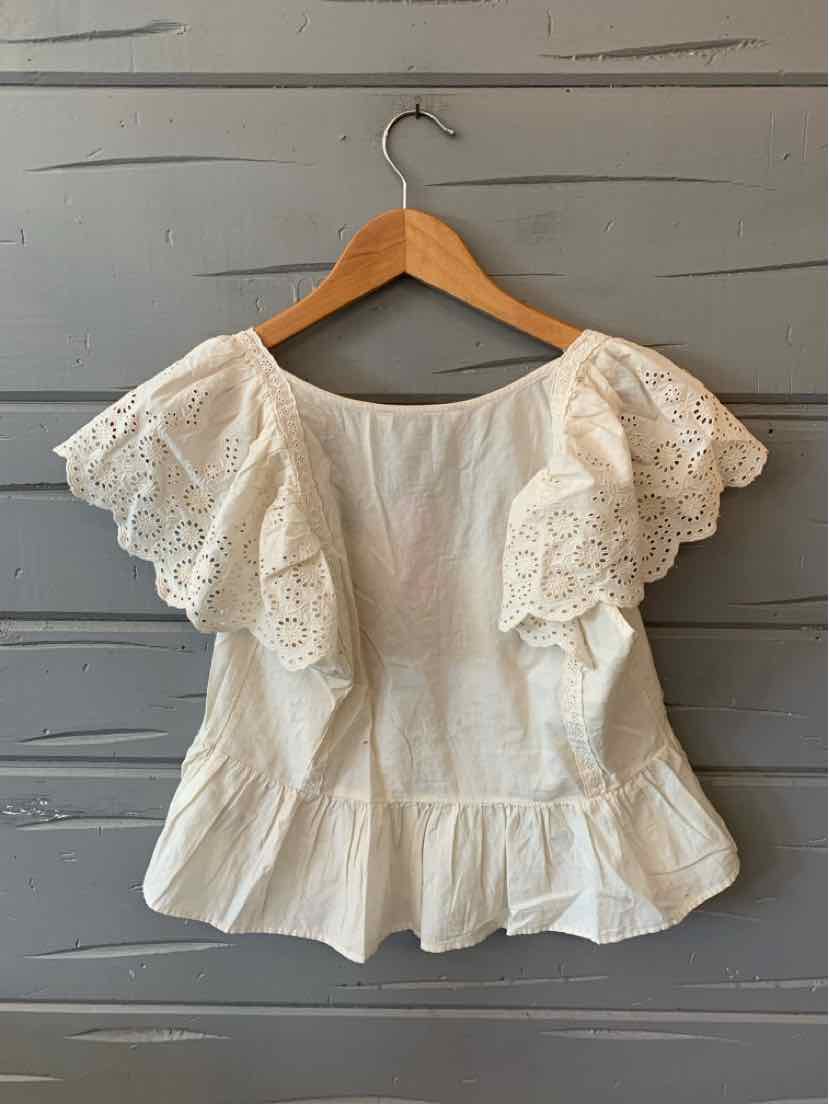 Beige eyelet blouse with scalloped flutter sleeves and peplum hem in size XS.