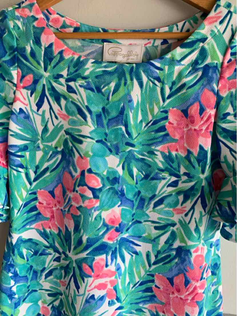Teal floral blouse with pink flowers and green leaves, round neckline, short sleeves, lightweight fabric.