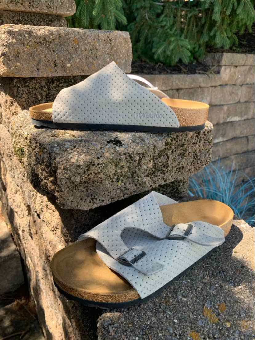 Beige Birkenstock sandal with perforated leather upper and adjustable buckle, size 41.