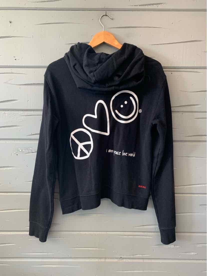 Black cropped hooded sweatshirt with white peace sign, heart, and smiley face graphics on the front.