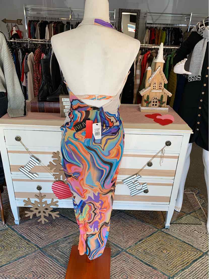 Colorful abstract print backless dress with thin crisscross straps, fitted silhouette.