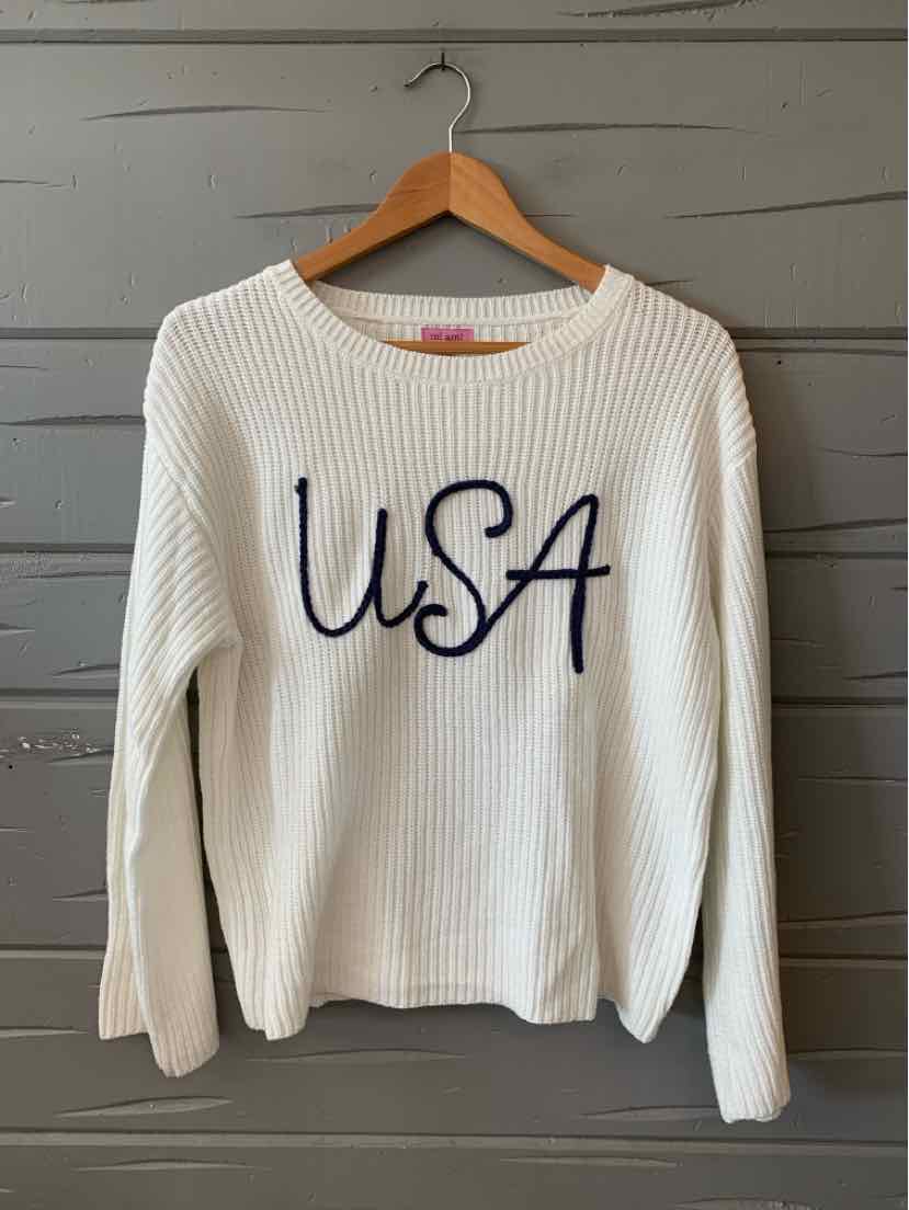 White ribbed knit long-sleeve sweater with "USA" embroidered in navy blue on front.