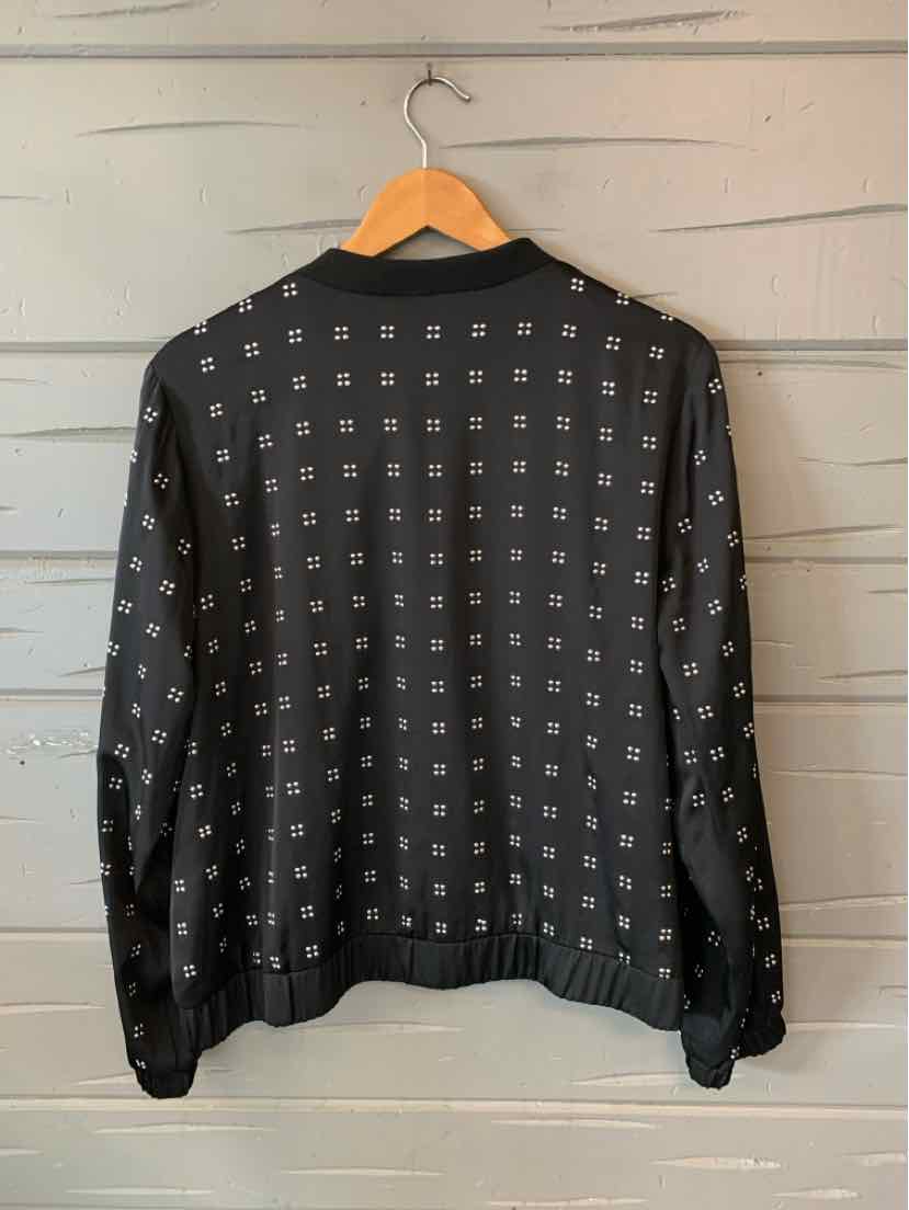 Black long-sleeve shirt with all-over small white square pattern and ribbed collar and cuffs.