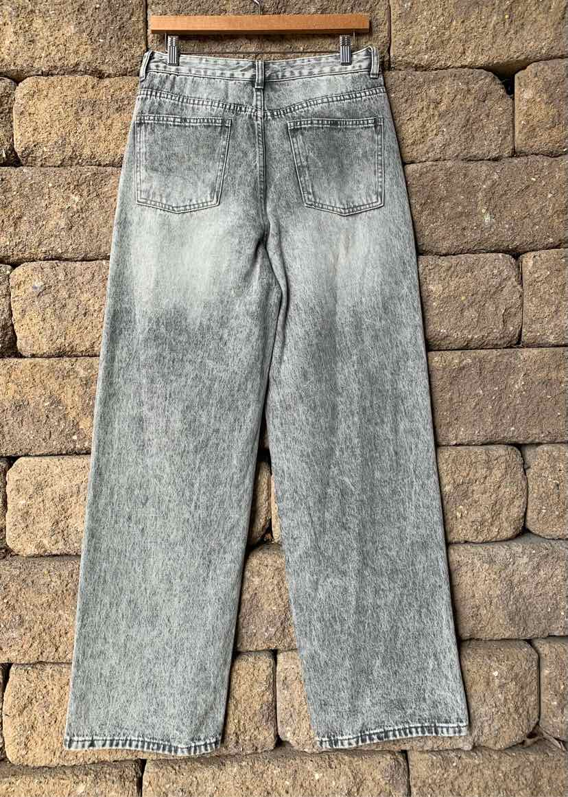 Gray acid-wash high-waisted wide-leg jeans with back pockets and belt loops.