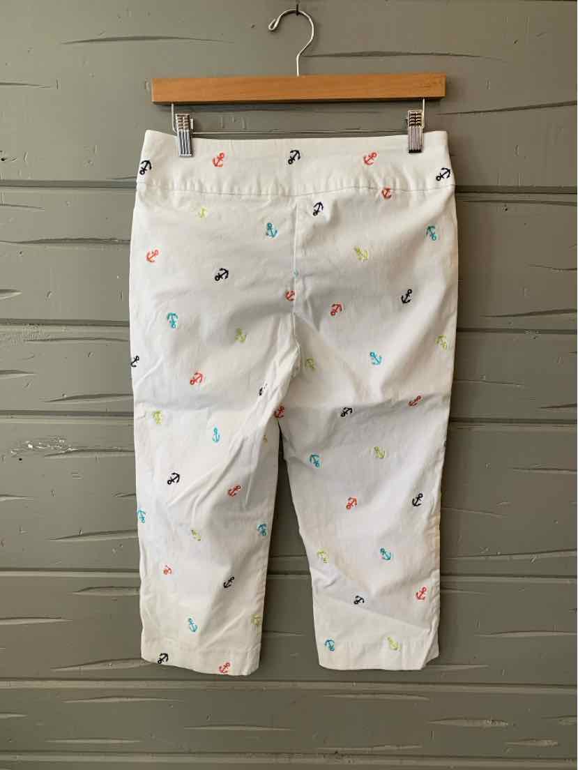 White cropped pants with colorful embroidered anchors scattered all over and a button waist closure.