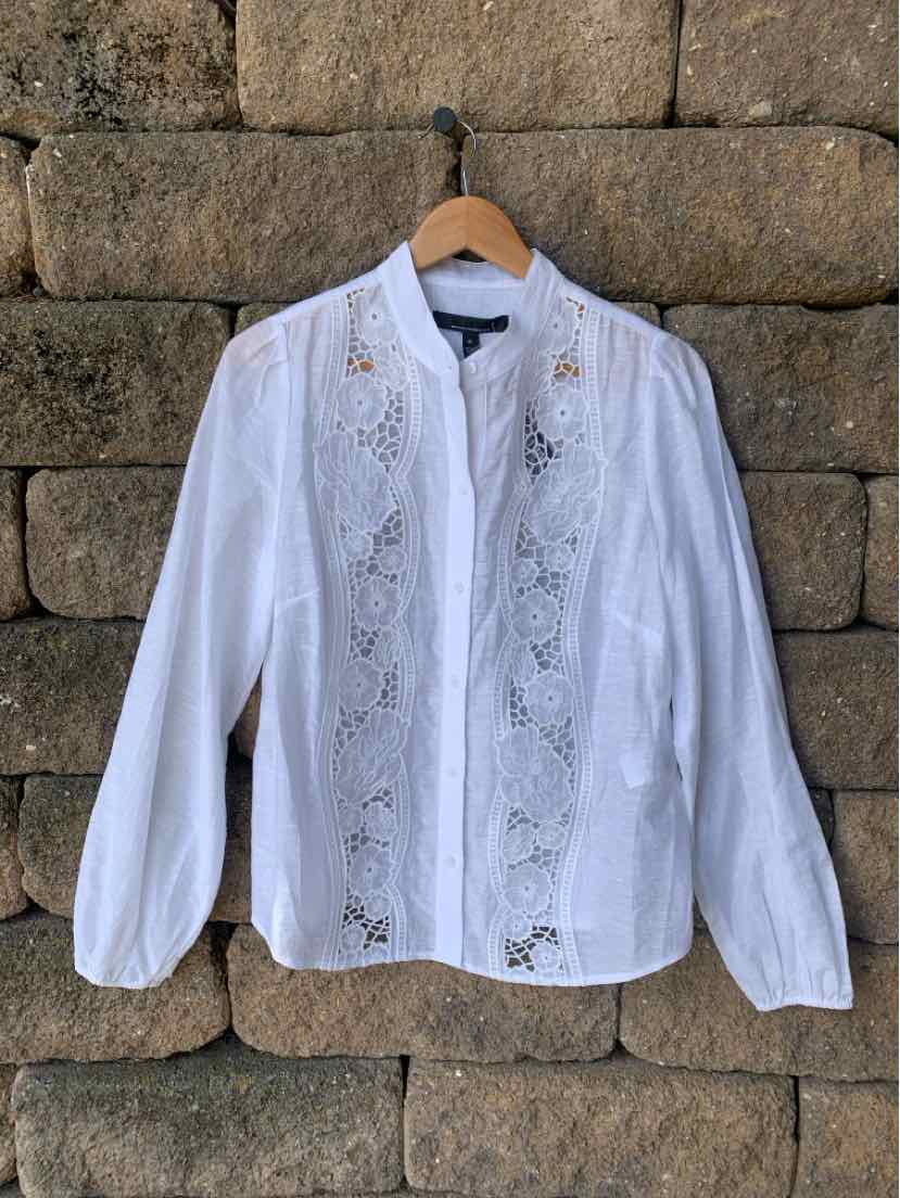 White long-sleeve blouse with lace panel detailing and button closure, medium size.