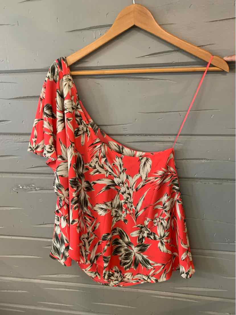 Red floral one-shoulder blouse with ruffle detail and thin strap on hanger.