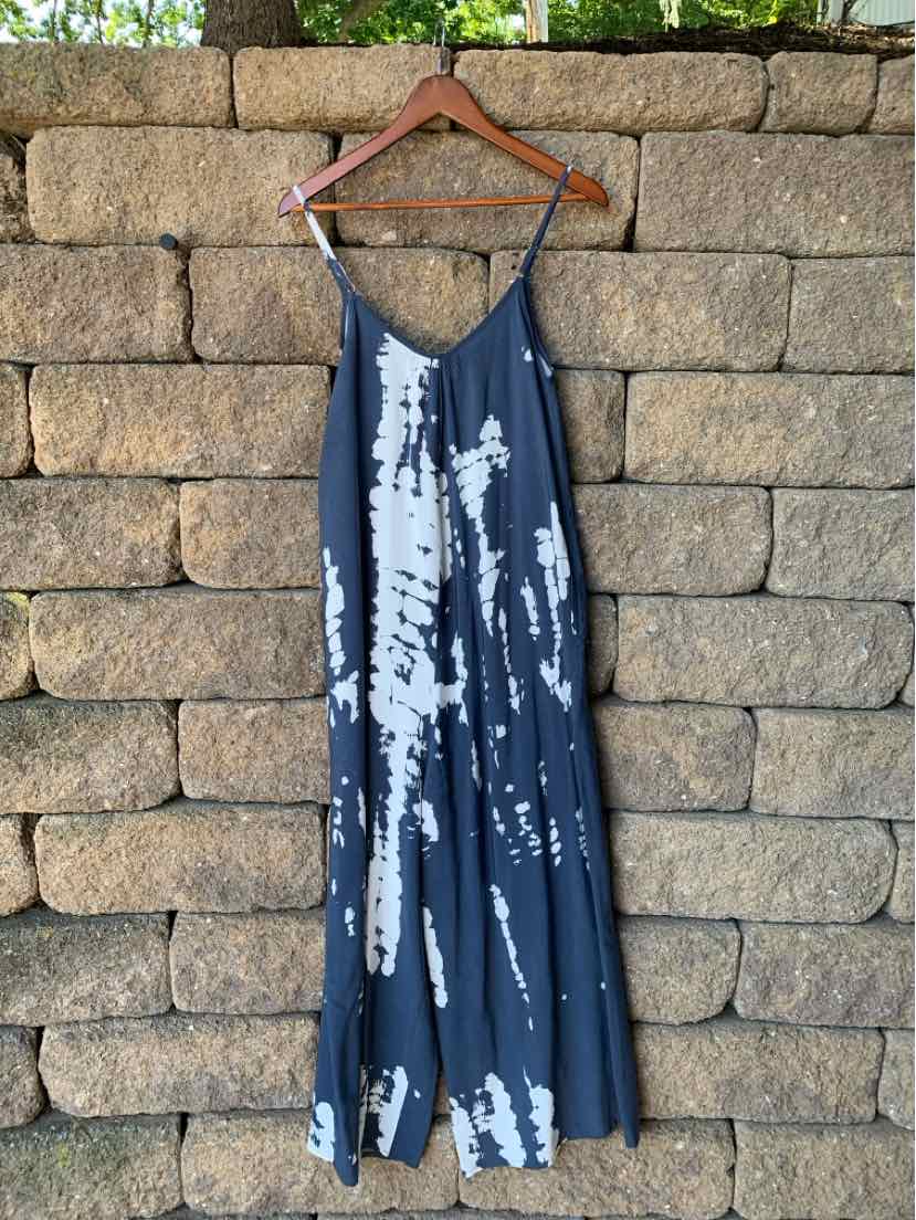 Navy blue tie-dyed slip dress with thin adjustable straps and flowing midi length.
