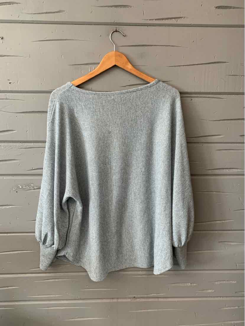 Gray long-sleeve pullover sweater with relaxed fit and boat neckline on wooden hanger.