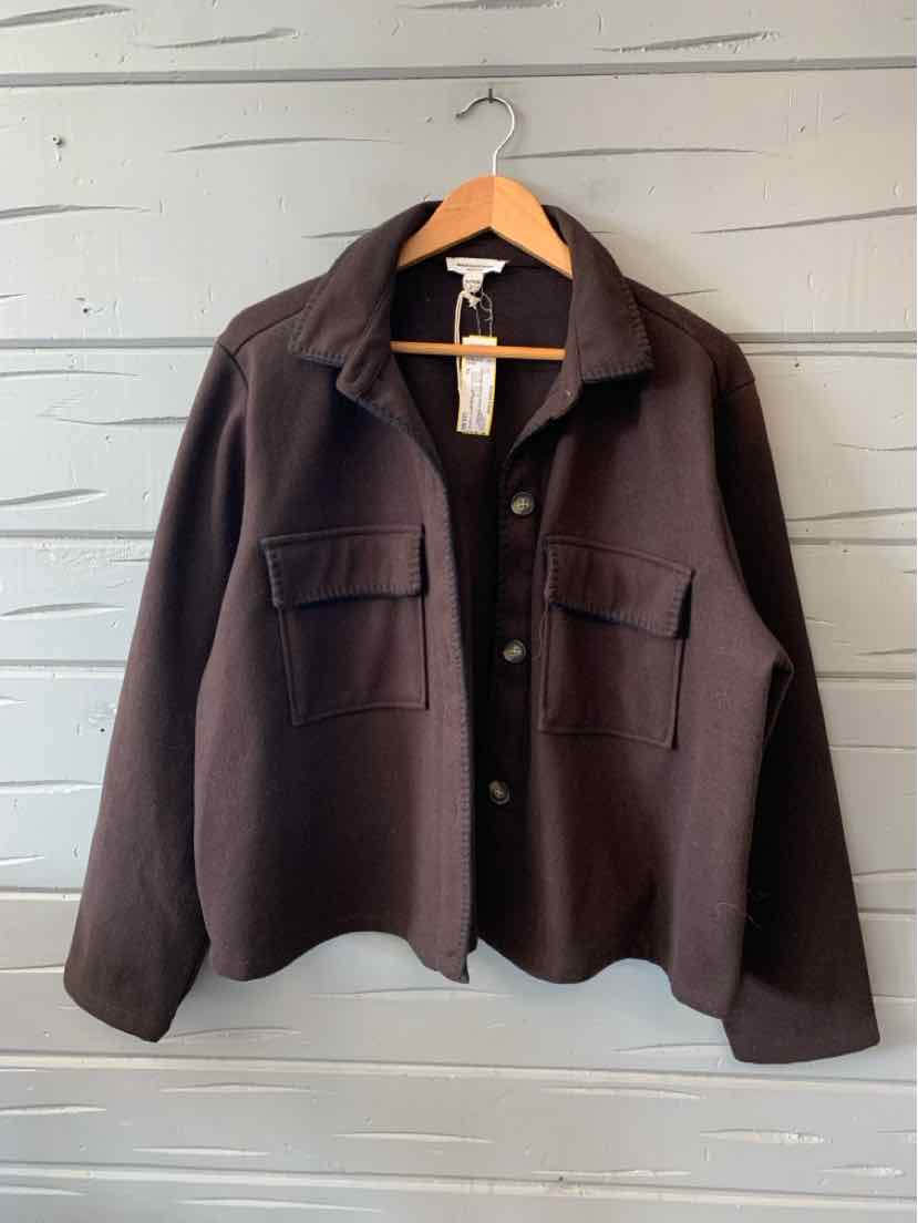 Black oversized button-up jacket with chest flap pockets and soft fabric, size XL.