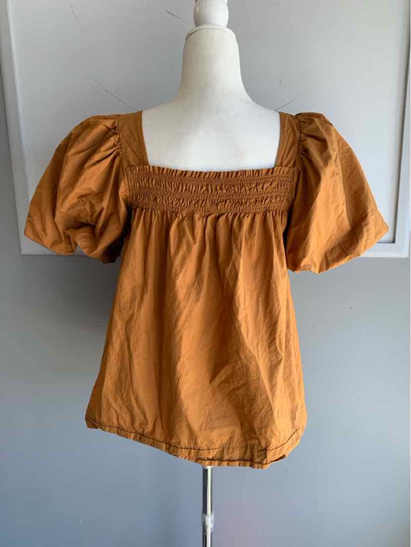 Tan short puff sleeve blouse with smocked square neckline in size small.