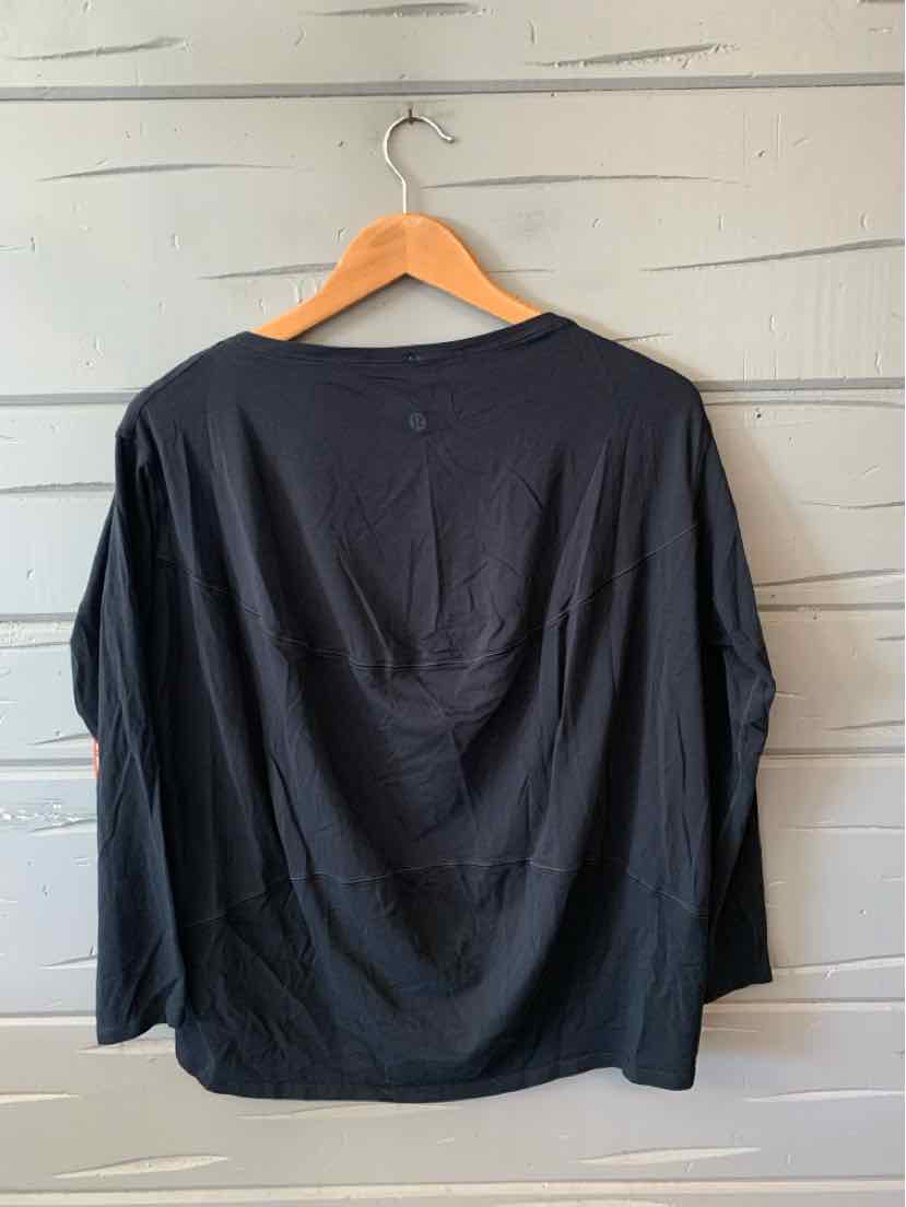 Black long-sleeve lightweight shirt with relaxed fit and subtle gathers at the back neckline.
