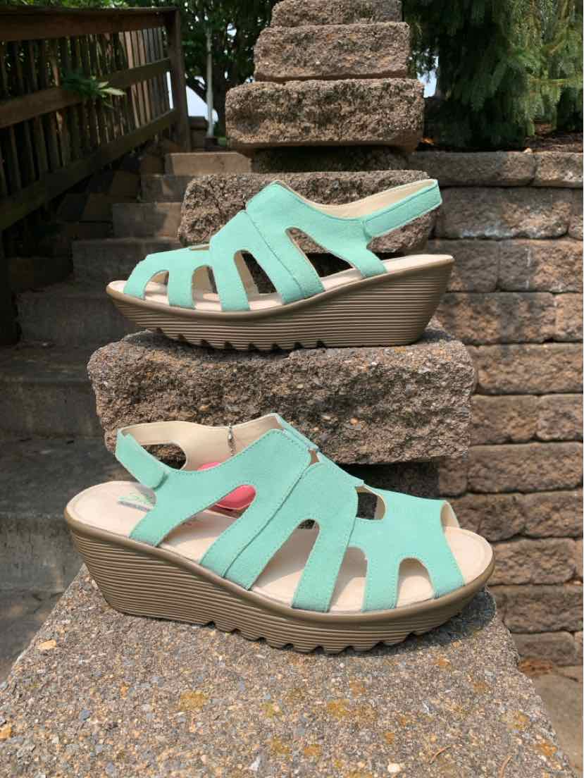 Teal wedge sandals with open toe and cut-out straps, cushioned beige footbed, size 10.