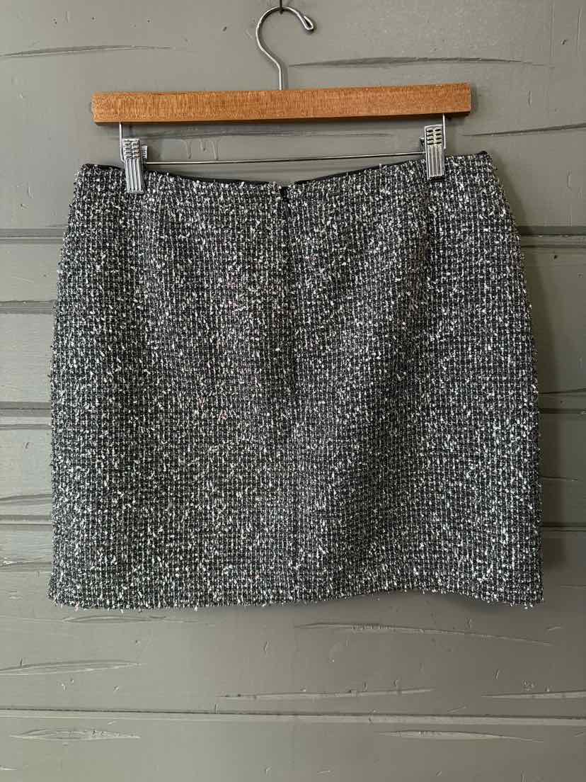 Silver metallic textured mini skirt with slight shimmer and subtle sparkle detailing.