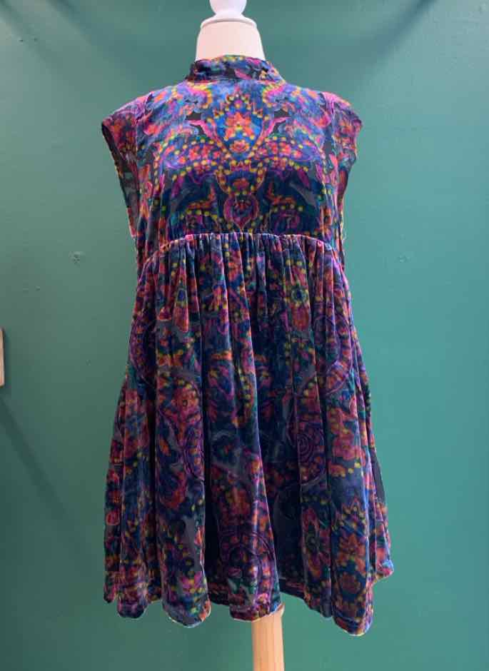 Sleeveless multi-color paisley dress with gathered waist and flared skirt.