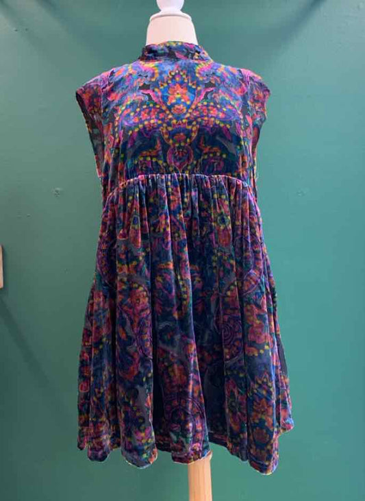 Sleeveless multi-color paisley dress with gathered waist and flared skirt.