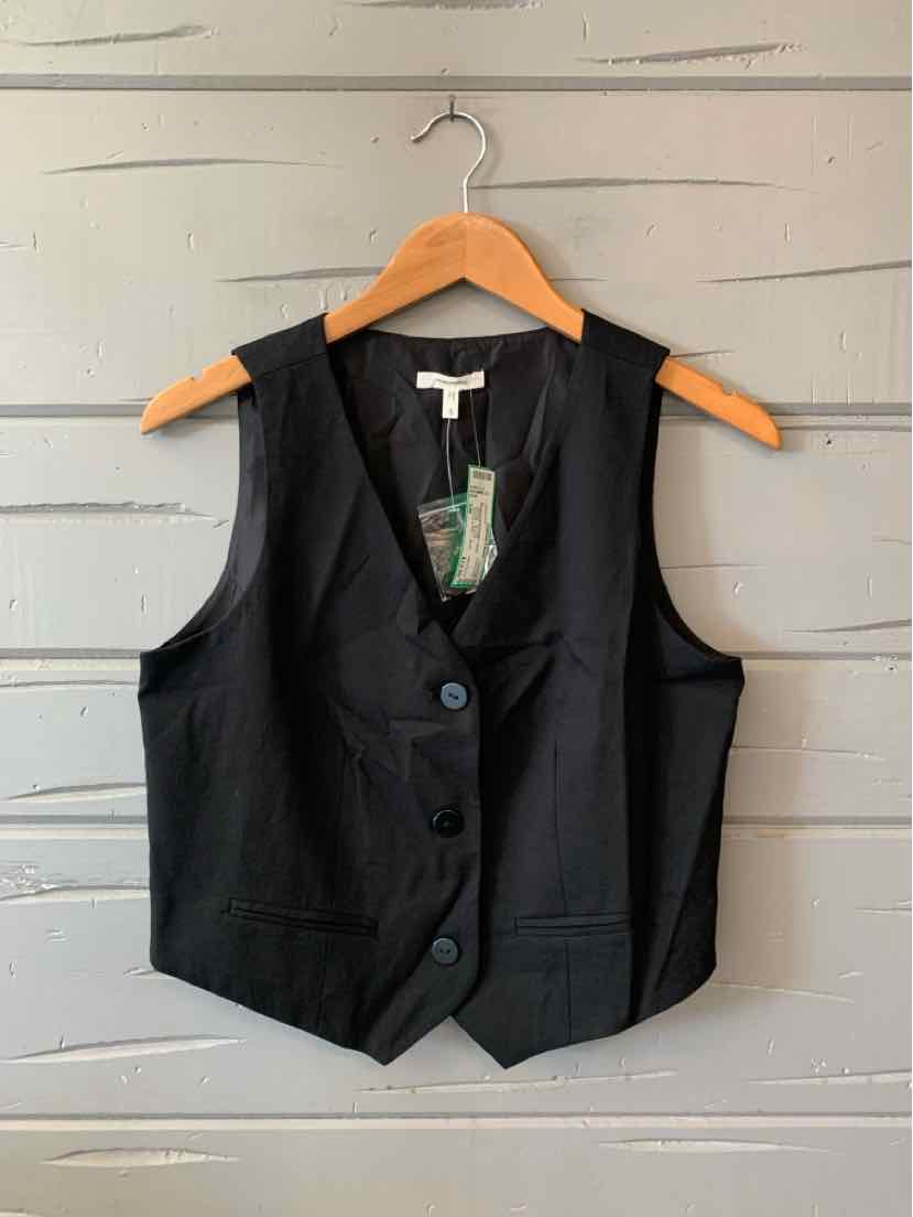 Black sleeveless tailored vest with three buttons and notched lapels on wooden hanger.