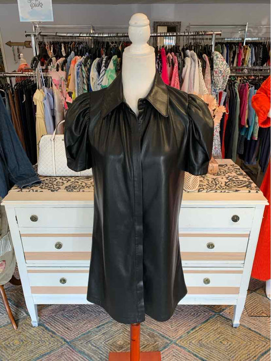 Black faux leather dress with short puff sleeves and a pointed collar, size small.