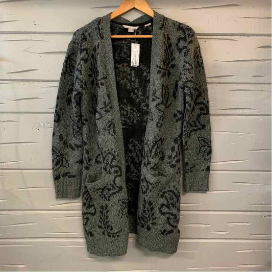 Gray knit open-front cardigan with black floral patterns and ribbed cuffs and hem.