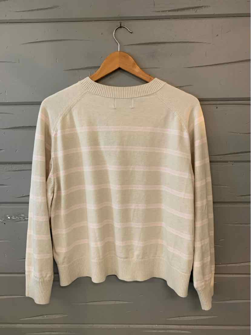 Beige knit sweater with subtle white horizontal stripes, crew neck, long sleeves, and ribbed cuffs and hem.