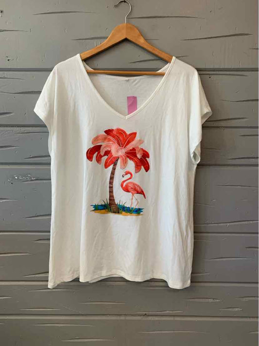 White short-sleeve T-shirt with V-neck and colorful flamingo palm tree graphic on front.