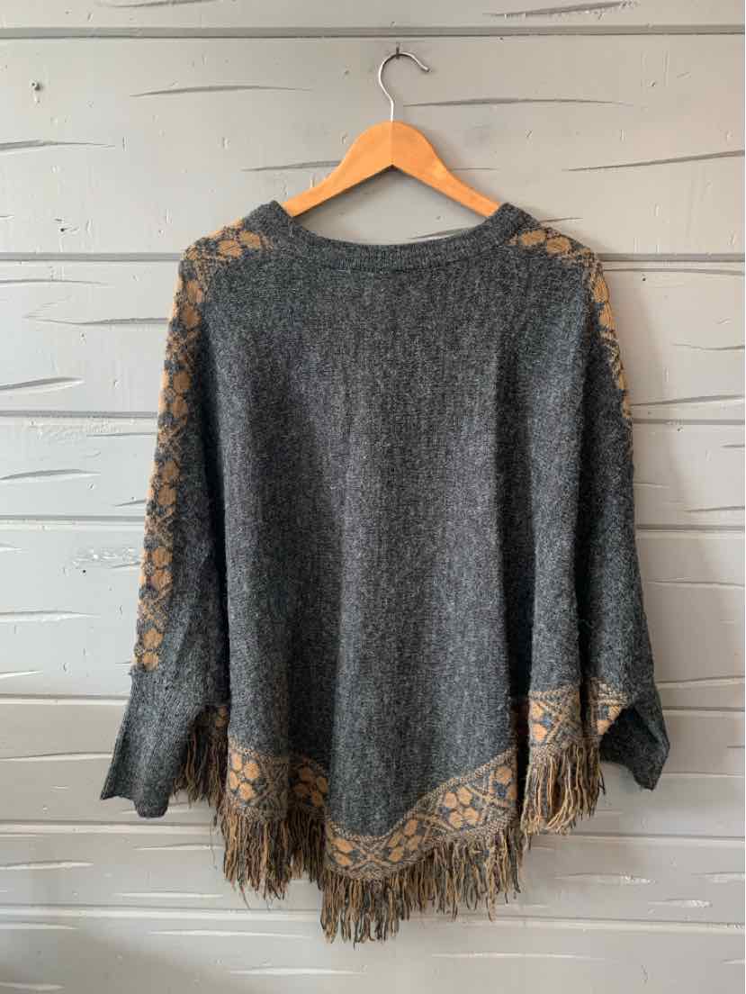 Gray knit poncho with tan lace detailing on shoulders and fringed hem in size M/L.