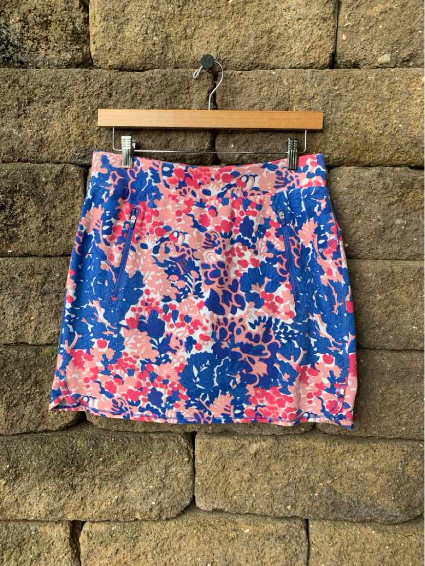 Blue and pink floral print skirt with a straight cut and front slit detail.
