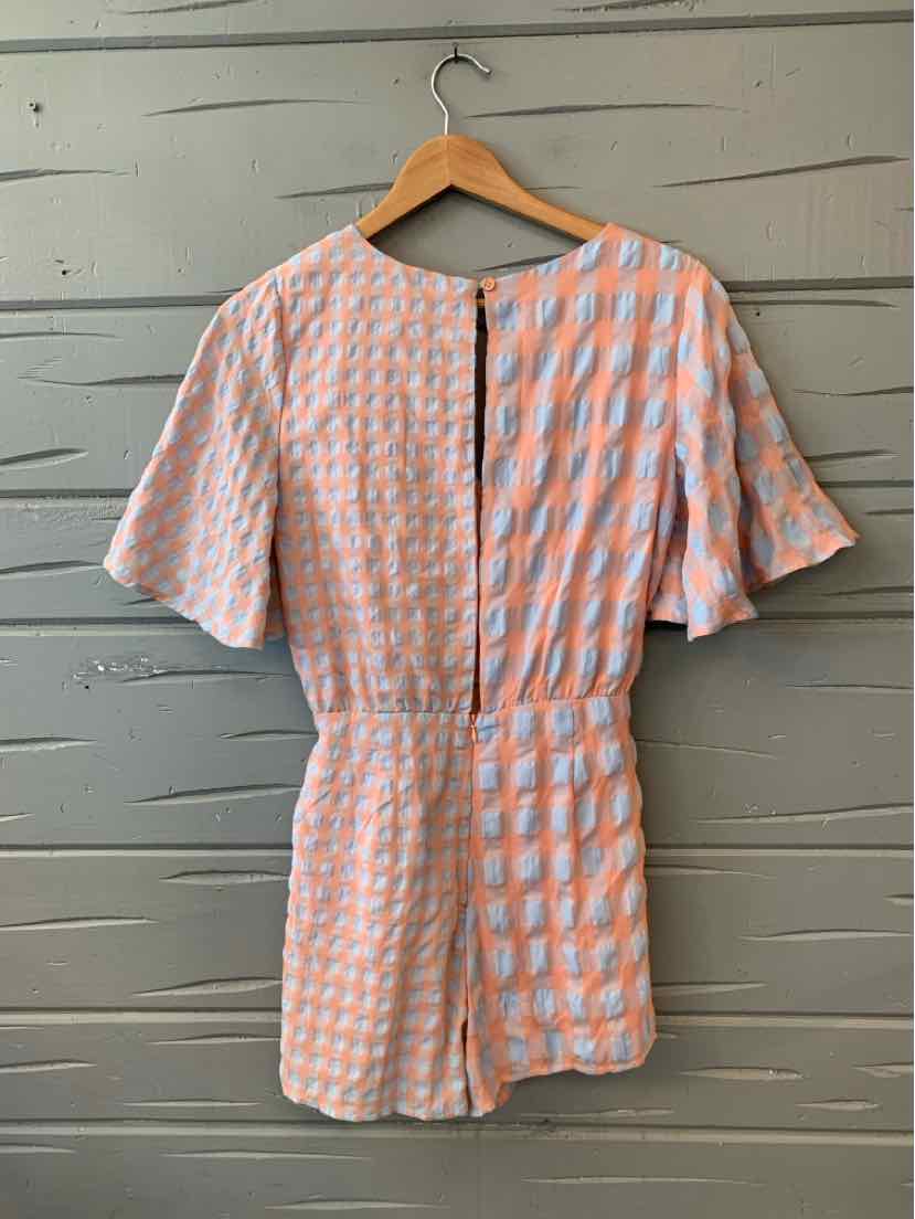 Blue and white gingham short-sleeve dress with gathered waist and back keyhole detail.