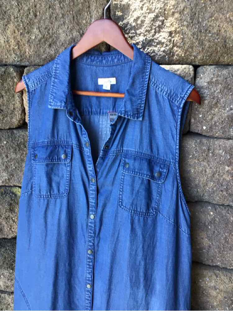 Sleeveless blue denim button-up shirt dress with chest pockets and collared neckline.