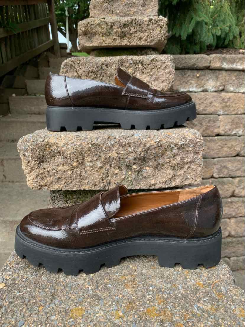 Dark brown patent leather loafers with chunky black lug soles, size 8.5.