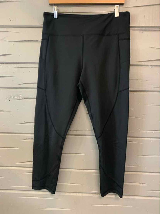 Black women's activewear capri leggings with high waistband and paneled detailing.