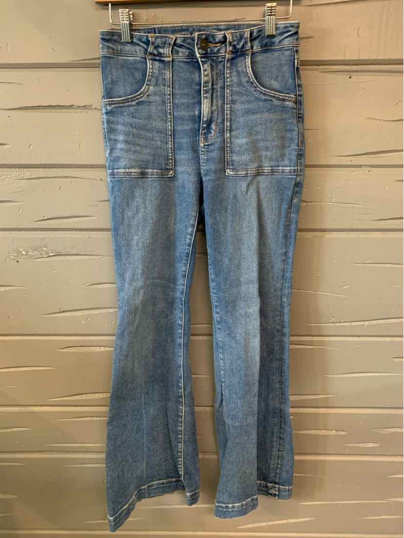 High-waisted light blue denim jeans with front patch pockets and flared legs.