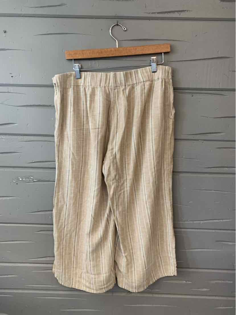 Beige wide-leg pants with vertical white stripes, elastic waistband, cropped length, lightweight fabric.
