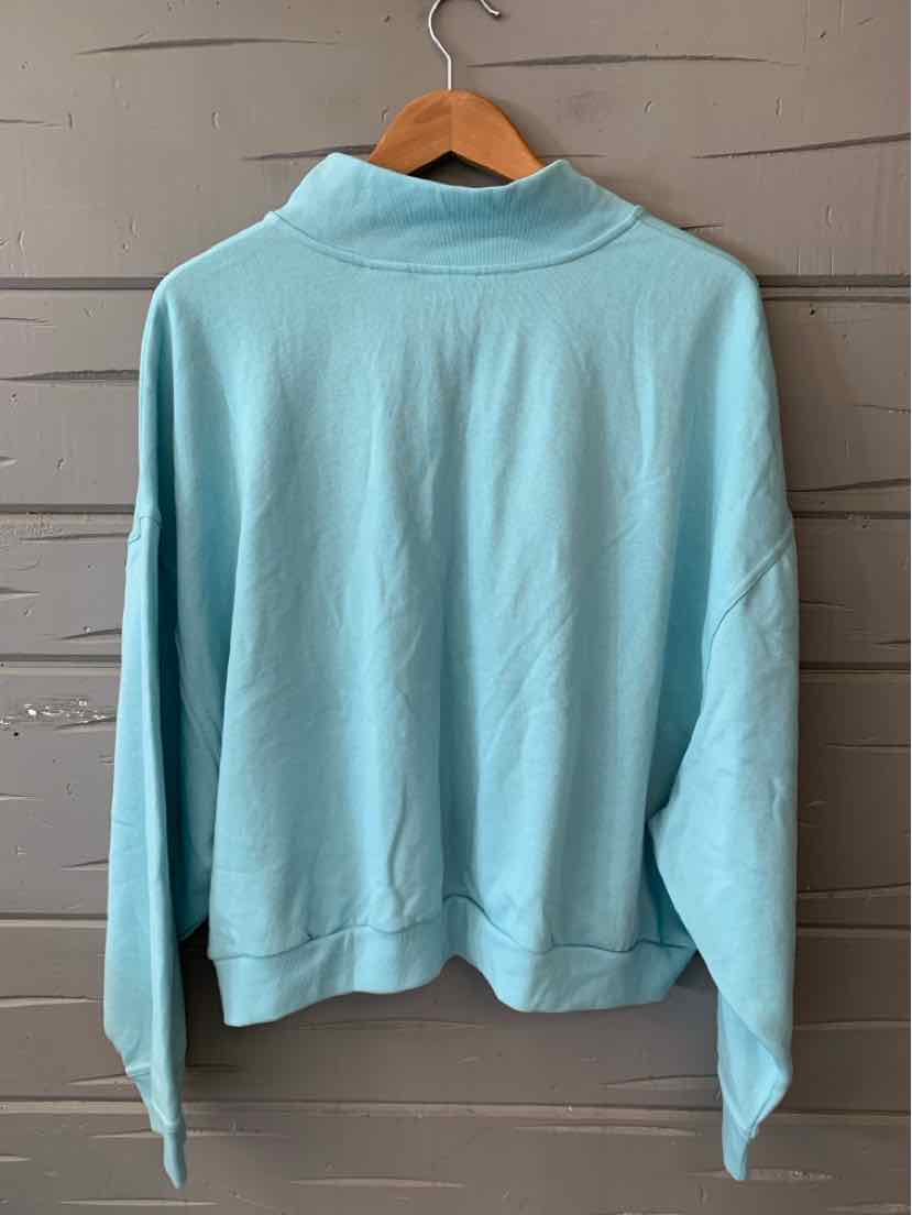 Light blue long-sleeve pullover with a high collar and relaxed fit, size 3X.