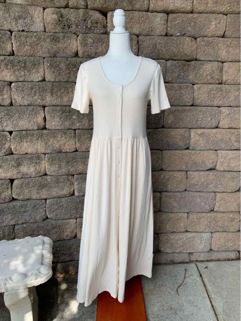 Cream-colored midi dress with short sleeves, button-down front, and gathered waist detail.