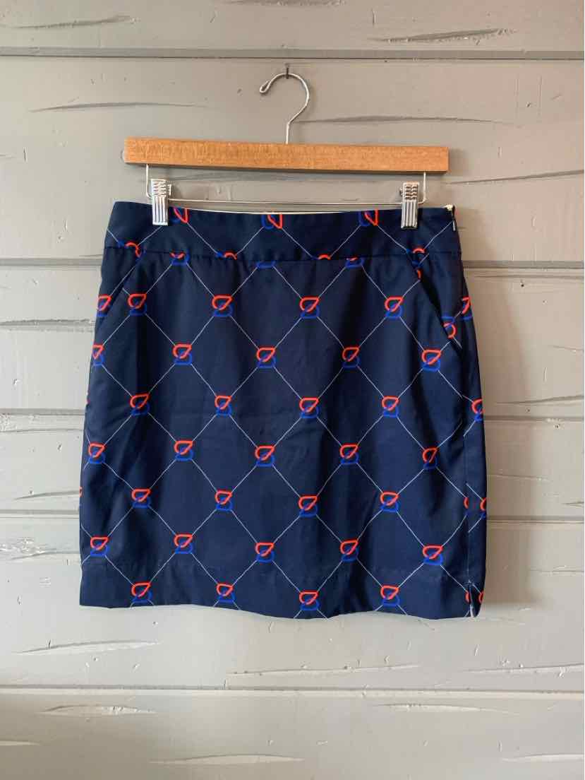 Navy blue skirt with a red and white geometric pattern, straight cut, knee-length, lightweight fabric.