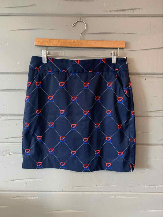 Navy blue skirt with a red and white geometric pattern, straight cut, knee-length, lightweight fabric.