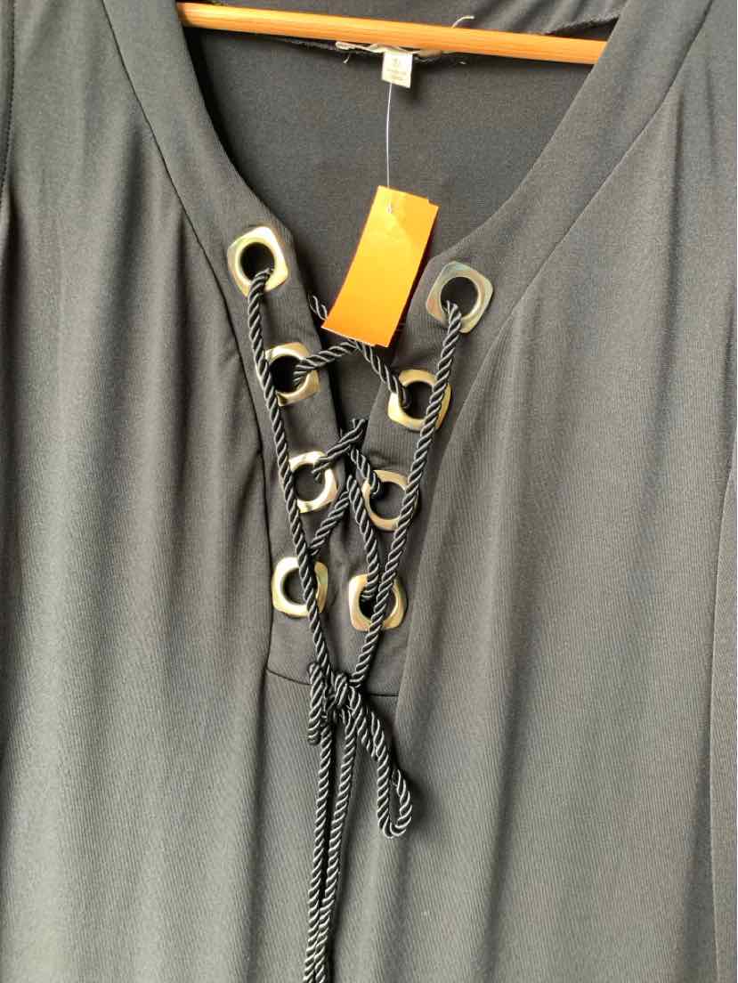 Black blouse with lace-up front and metal eyelets in size 2X, soft fabric drape.