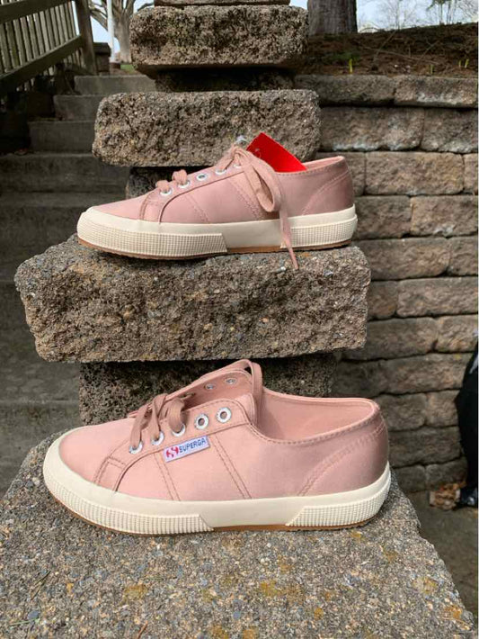 Pink Superga RS sneaker size 6 with white sole and pink laces displayed on stone steps.