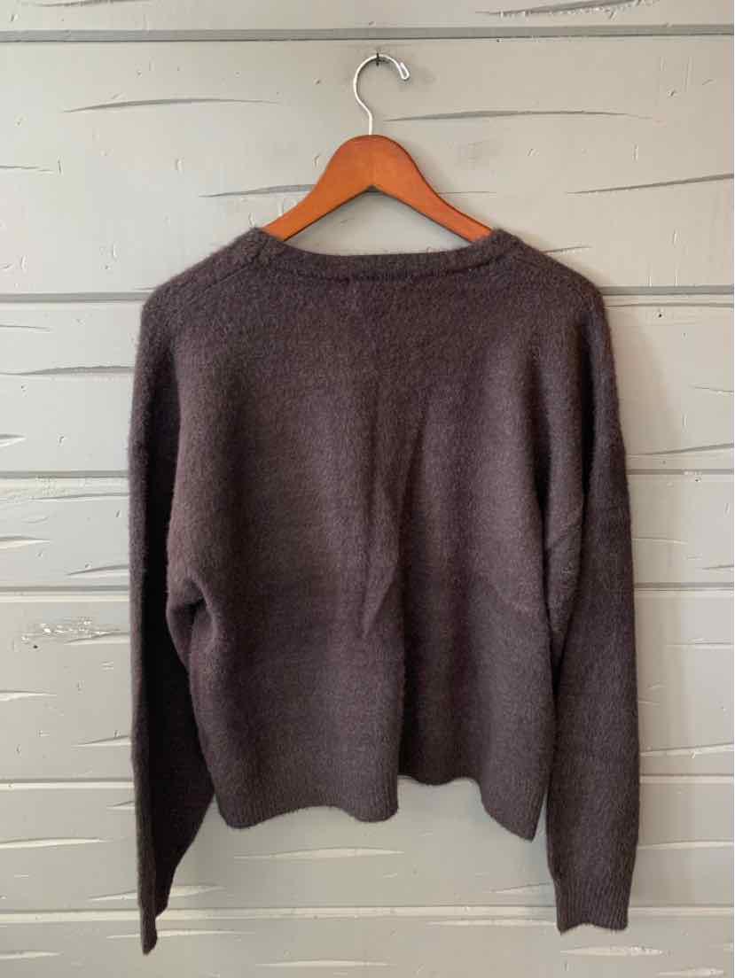 Dark brown Rachel Zoe long-sleeve sweater with a wide neckline and ribbed hem, hanging on a wooden hanger.