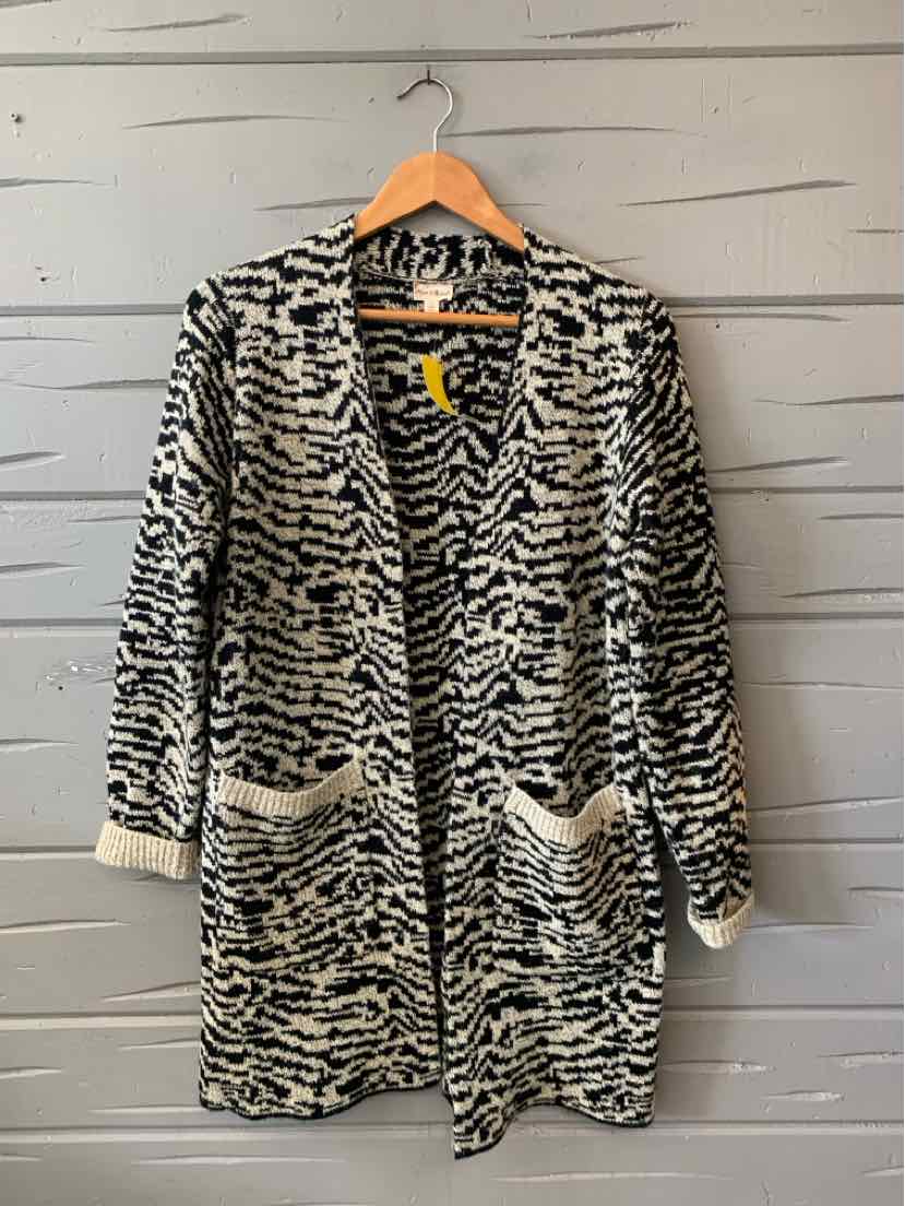 Black and white patterned open-front cardigan with long sleeves and front pockets, small size.