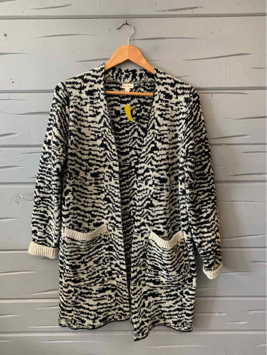 Black and white patterned open-front cardigan with long sleeves and front pockets, small size.