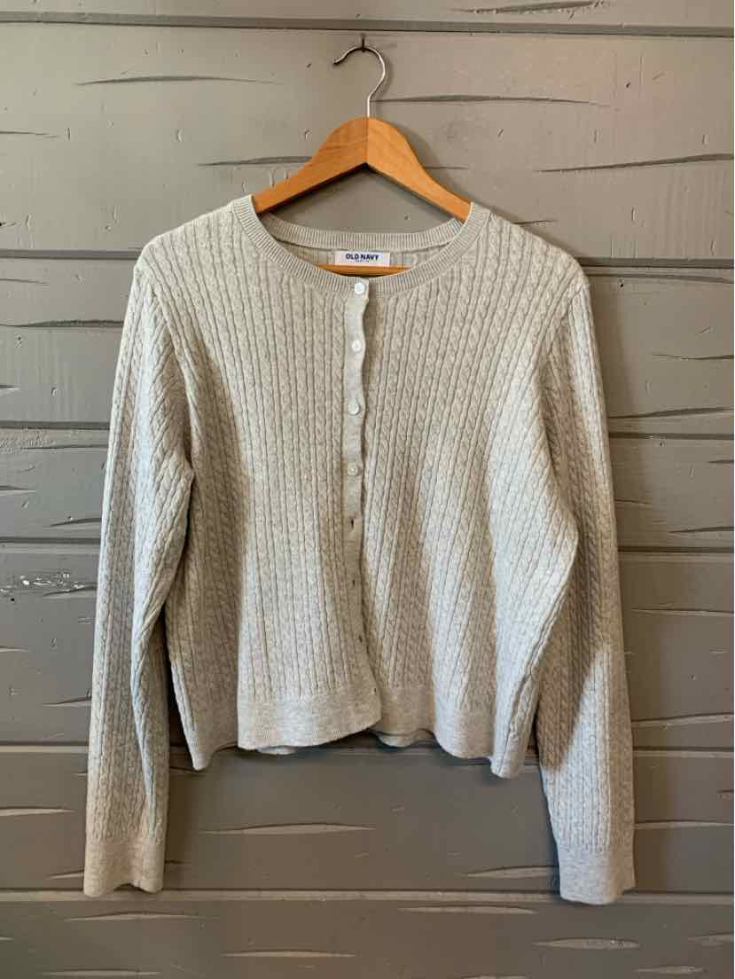 Light gray ribbed knit cardigan with long sleeves and a round neckline on a wooden hanger.