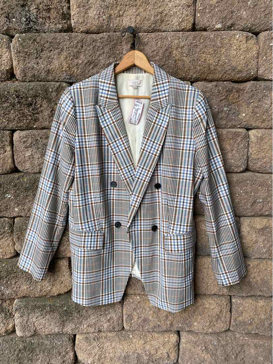 Women's oversized blazer in multi-color plaid with double-breasted buttons and notch lapels.