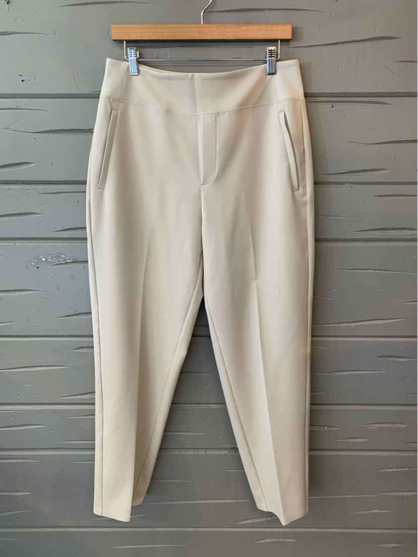 Beige slim-fit Athleta pants with front pockets and a high waist, size 10.