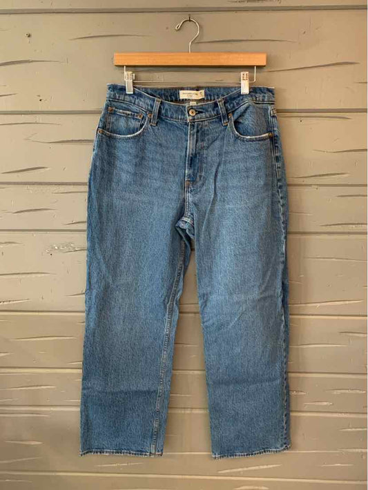 Women's blue denim straight-leg jeans with classic five-pocket design and belt loops, size 6.
