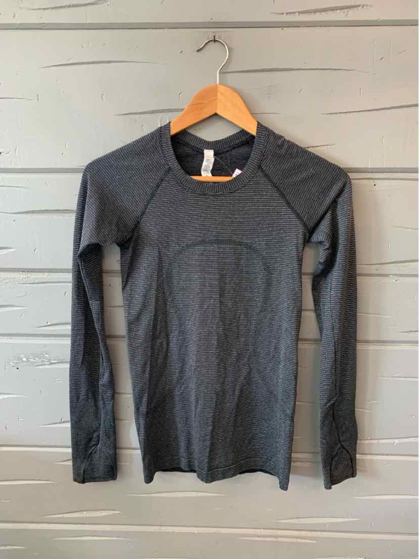Dark gray long-sleeve athletic shirt with crew neck and subtle metallic sheen, slim fit design.
