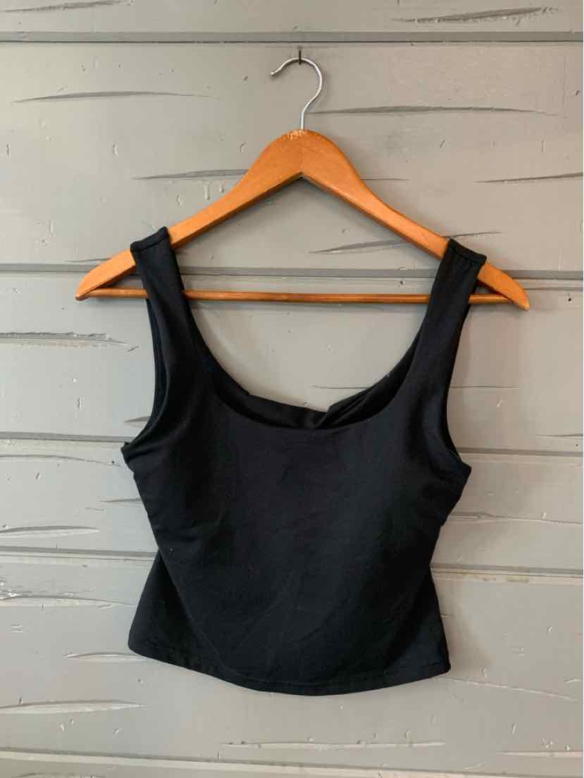 Black fitted tank top with wide shoulder straps and square neckline on wooden hanger.