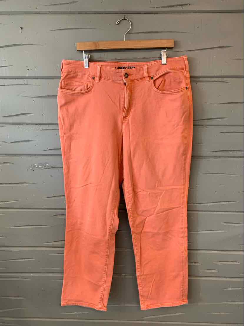 Coral straight-leg denim pants with front button and zipper closure, five-pocket design.