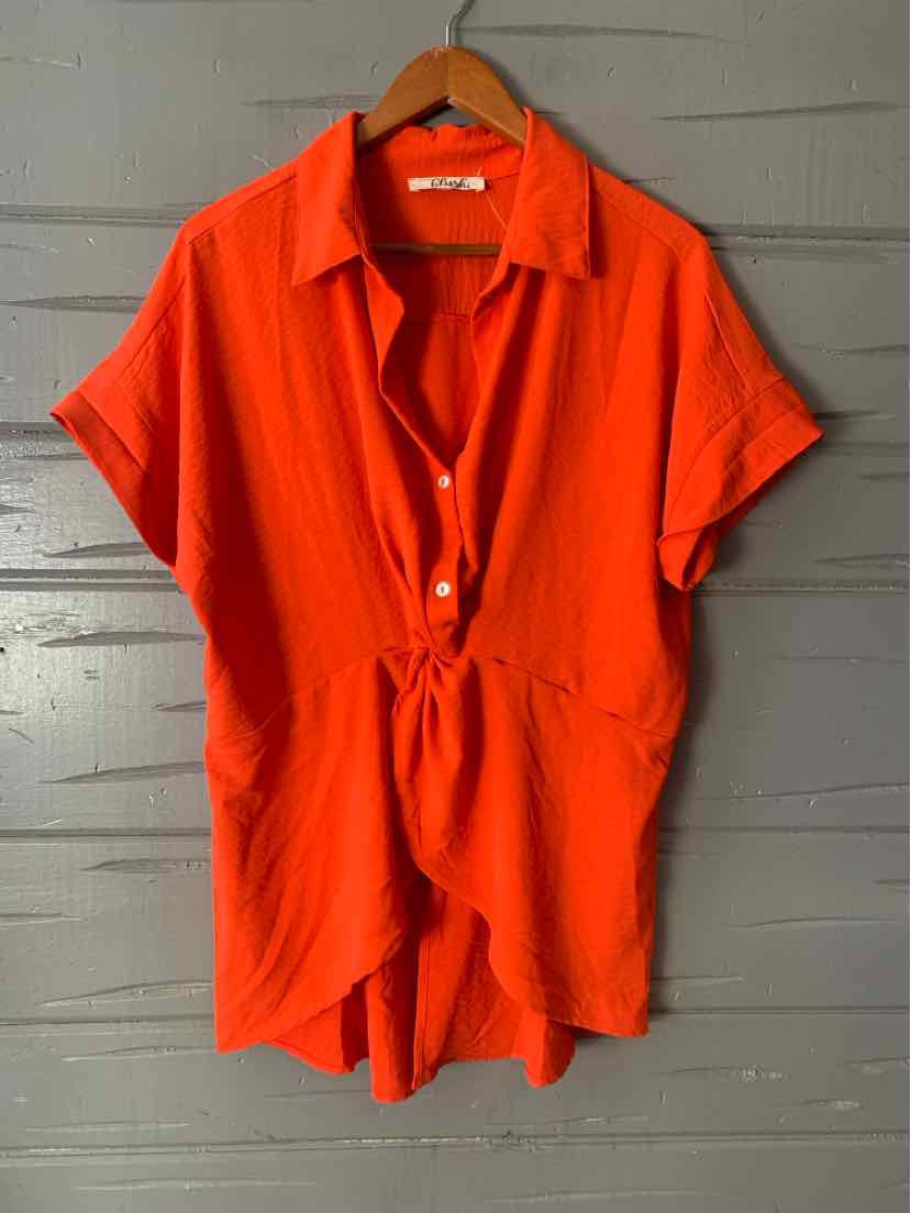 Red short-sleeve romper with collar, button front, and cinched waist in size 1X.